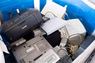 Old electronics in a bin.